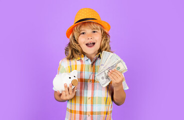Kid saving money for purchase, hold pink piggy bank. Child learning to calculate personal budget, manage finance, playing investment, accounting. Business, saving and economic.