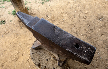 Old century vintage iron anvil used by blacksmiths for working metals