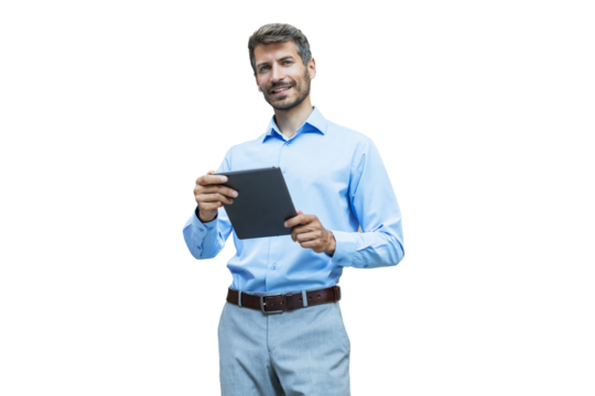 Modern business man in formalwear using digital tablet while standing on a transparent background