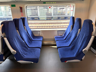 Empty seats in train. Modern public transport concept. Handheld mobile photo, selective focus, non...