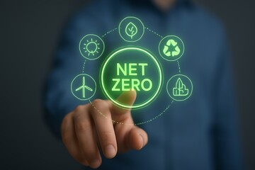 Person touching glowing green net zero circular diagram with environmental icons image