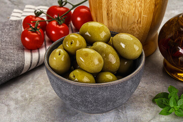 Big green marinated olives in the bowl