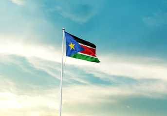 South Sudan national flag waving with skyline and buildings. Sudan national flag for independence day.