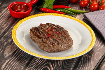 Grilled beef burger cutlet with sauce