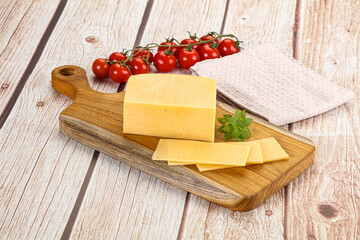 Yellow cheese piece with slices