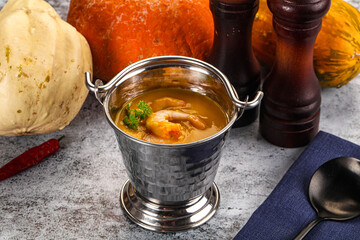 Pumpkin cream soup with prawns