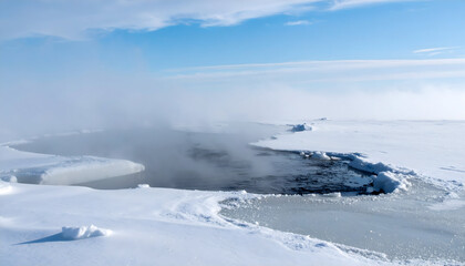 Fototapeta premium Mystical Arctic landscape with icy waters and foggy atmosphere under a bright blue sky