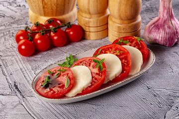 Italian caprese salad with mozzarella, tomato and basil