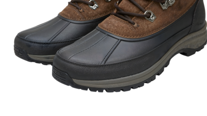 Closeup of durable waterproof hiking boots with brown suede and black rubber outsoles for outdoor activities