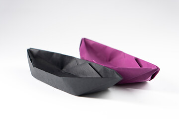 Paper boat on a white background. Origami ship. Paper crafts.