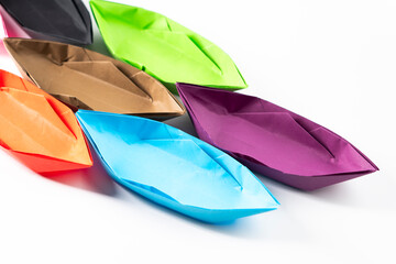 Paper boat on a white background. Origami ship. Paper crafts.