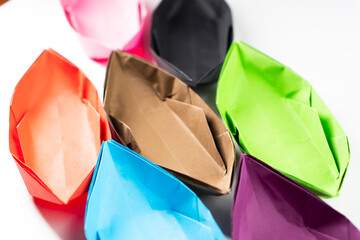 Paper boat on a white background. Origami ship. Paper crafts.