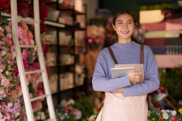 Asian Adult Florist Woman Manages Flower Shop Business Using Tablet Smiling Friendly Retail Environment Floral Entrepreneurship