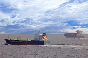 Cargo vessel leaving wake on Baltic Sea horizon