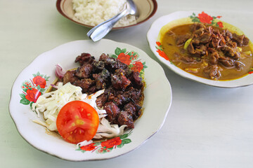 Traditional Indonesian Tongseng and Satay with Rice on a Table