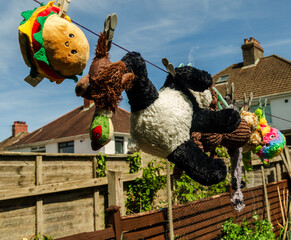 Belfast Co. Down Northern Ireland May 15 2025 - Variety of dogs toys hanging on a washing line to...