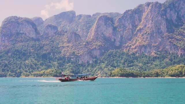 Tourism and travel to popular places in Thailand and Asia. Gliding Through Paradise: Traditional Longtail Boat Tour on Cheow Lan Lake,
