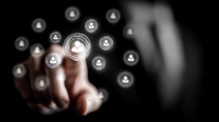 Finger interacting with glowing digital network of people icons on a dark background