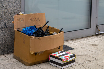 A worn cardboard box labeled 