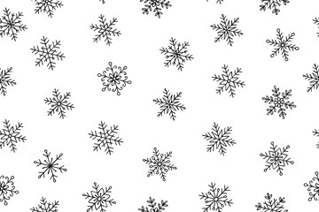 Winter festive seamless pattern with snowflakes in doodle style. Black and white vector illustration