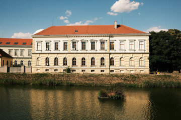 Riverside view of a neoclassical yellow and white building in Zrenjanin, Serbia. Elegant...