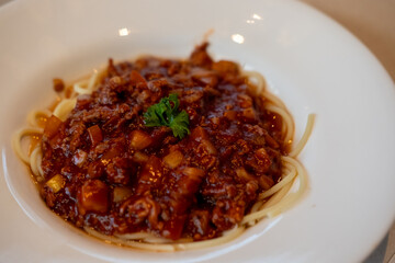 Spaghetti Bolognese, a meat-based sauce in Italian cuisine. served on plate
