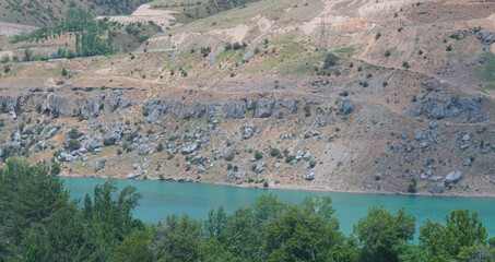 Mountains are visible on the river bank.
