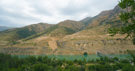 Mountains are visible on the river bank.