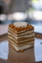 Medovik, Russian and Soviet honey cake served on plate in the cafe
