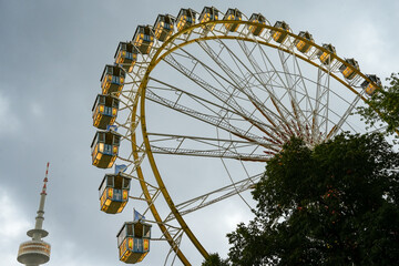 Munich, Bavaria, Germany, August 2, 2025. Summer festival in the Olympic Park, Munich. Ferris wheel...