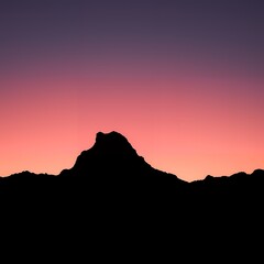 Fototapeta premium Dramatic mountain silhouette against a vibrant sunset sky