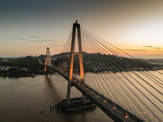 Obraz premium Aerial View of Mahakam Bridge at Sunset in Samarinda, Indonesia
