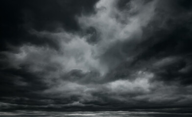 dark dramatic sky with black stormy clouds before rain as abstract background, extreme weather