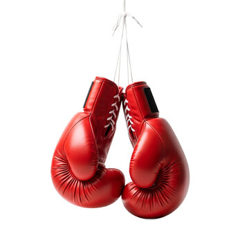 Pair of bright red leather boxing gloves hanging by their laces against a stark black background isolated on transparent background