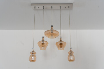 Elegant pendant lighting design with soft amber glass shades elevates modern home decor 
