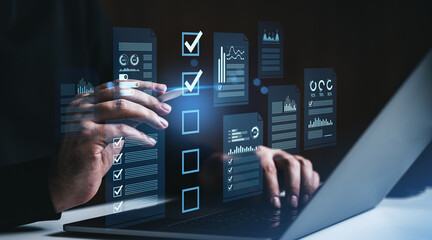 Digital checklist interface with data analysis charts and graphs appearing as holograms while...