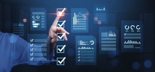 Business analytics checklist concept with digital reports and data visualization on virtual interface in futuristic blue-themed workspace background.