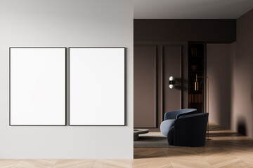 Modern interior with two blank poster mockups on clean wall and cozy armchairs in stylish living...