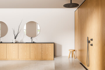 Modern minimalist bathroom interior design with wooden vanity, round mirrors, rain shower, and neutral colors on bright background. 3D Rendering. 3D Rendering