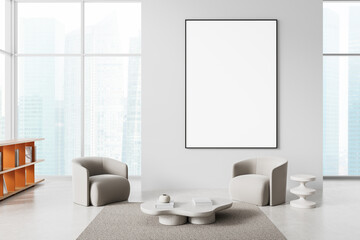 Fototapeta premium Modern interior with blank vertical poster on wall above minimal lounge chairs and table in bright open space with city view through large windows. 3D Rendering