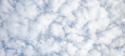 blue sky with white clouds. The sky is clear and bright