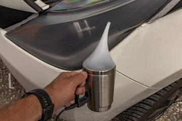 Chemical preparation for cleaning damaged car headlight lenses, heated teapot with chemicals for...