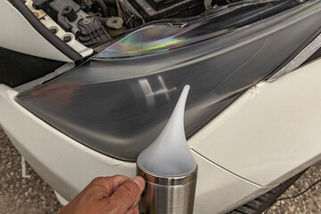 Chemical preparation for cleaning damaged car headlight lenses, heated teapot with chemicals for...