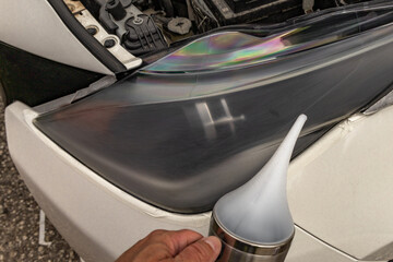 Chemical preparation for cleaning damaged car headlight lenses, heated teapot with chemicals for...