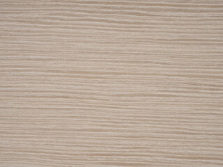 Fototapeta premium Streamlined and polished, this ash veneer surface presents a dance of beige and cream striations
