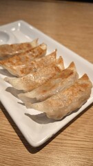 Gyoza on a wooden table in a restaurant