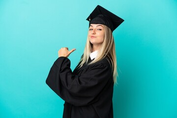Young university graduate over isolated blue background proud and self-satisfied