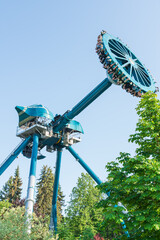 Amusement park ride big pendulum discovery thrilling ride. Cheerful entertainments in park of...