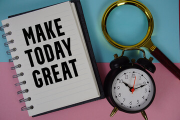 Make Today Great text written on notebook paper with magnifying glass and alarm clock