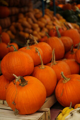 Orange and yellow pumpkins at the farmer's market. Harvest time in autumn.